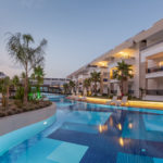 Luxury Construction hotel with Swimming Pool at sunset